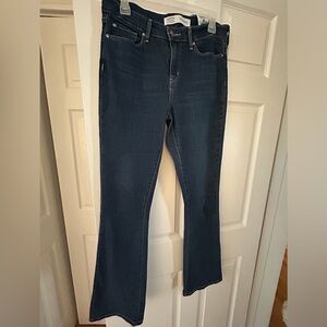 Signature mid rise boot cut jeans